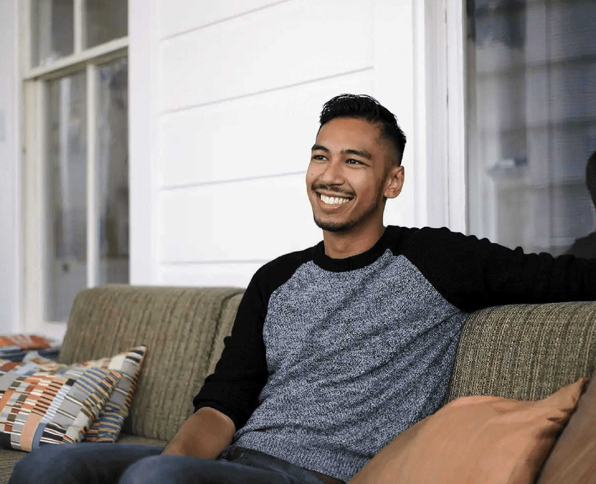 Shaun Pezeshki sitting and smiling